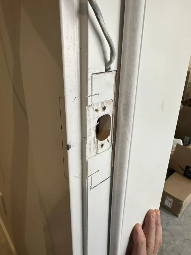 Close-up of a door with the lock mechanism being installed.